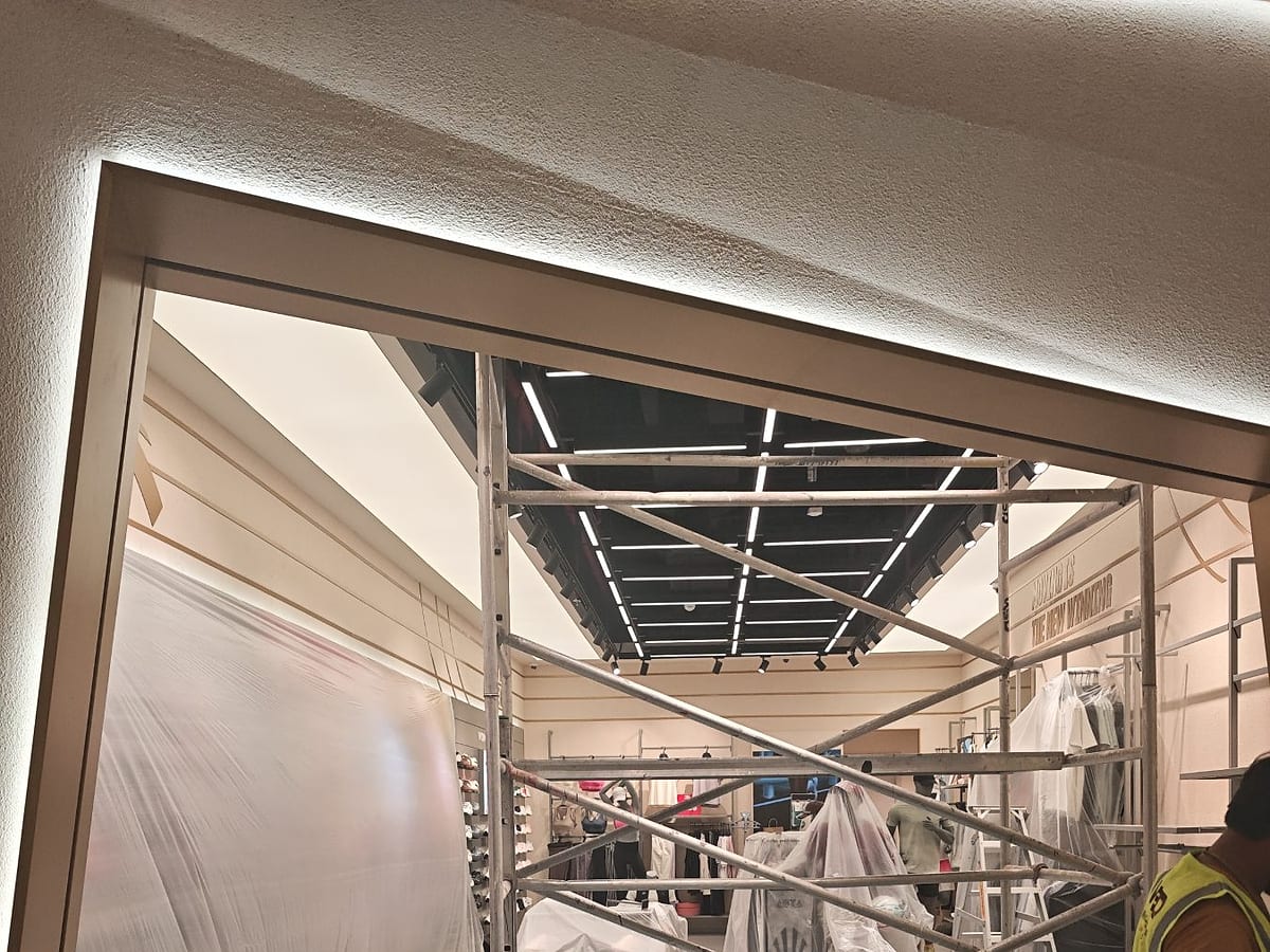 ANTA storefront frame and lighting during fit-out